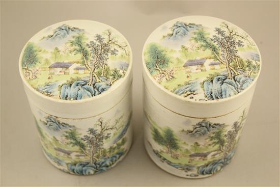 Two Chinese famille rose cylindrical jars and covers, 13cm and 13.5cm